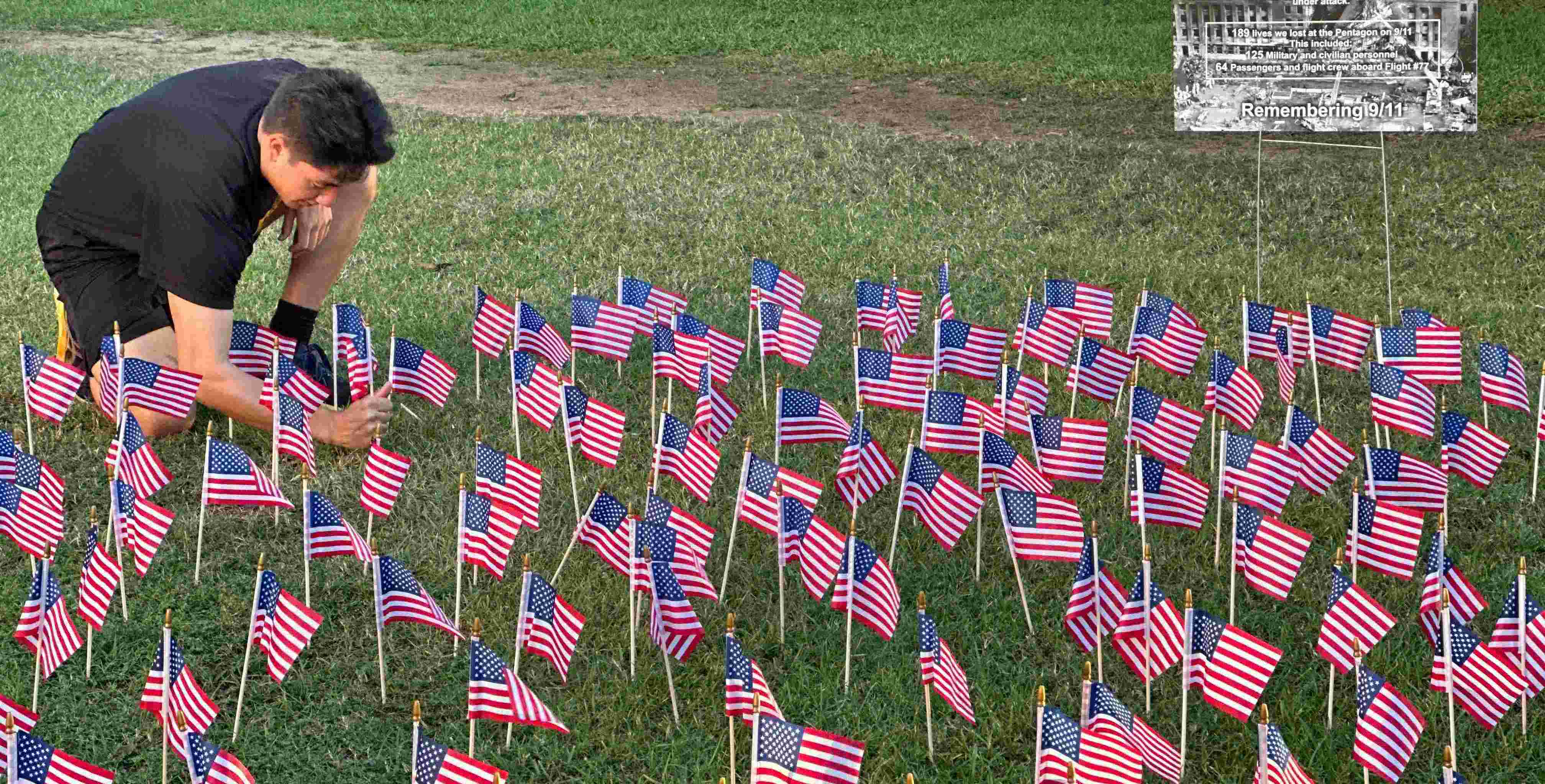 student laying flags for memorial