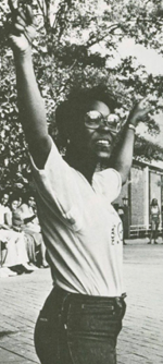 woman standing with sign