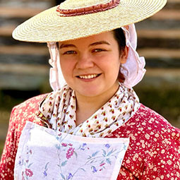 woman in period cosutme outside