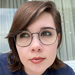 photo of a woman with dark and and glasses on