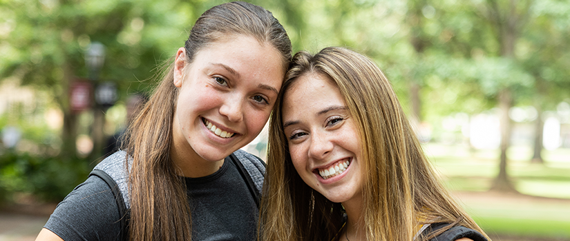 two students smiling 