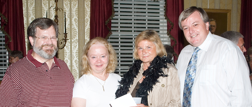 Pat Moody (second from right) poses with three other people who attended her retirement party