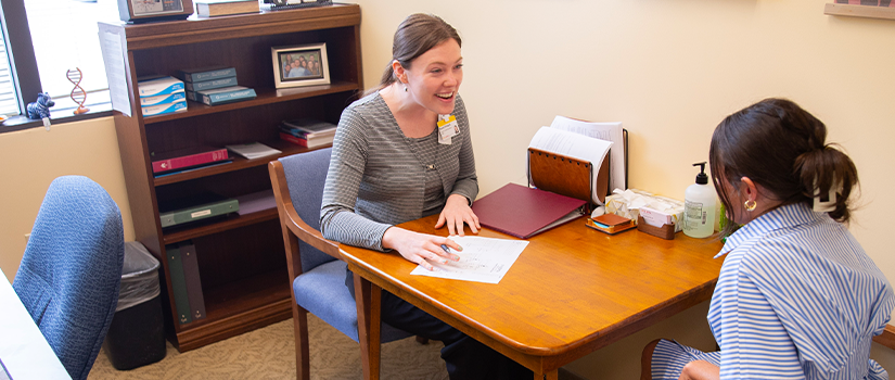 Genetic counseling student in a consultation
