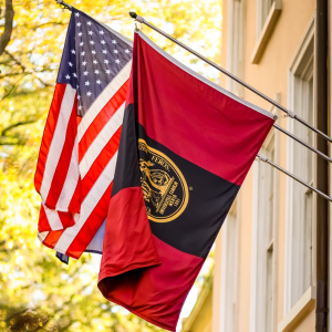 south Carolina flag hanging beside a USC and american flag