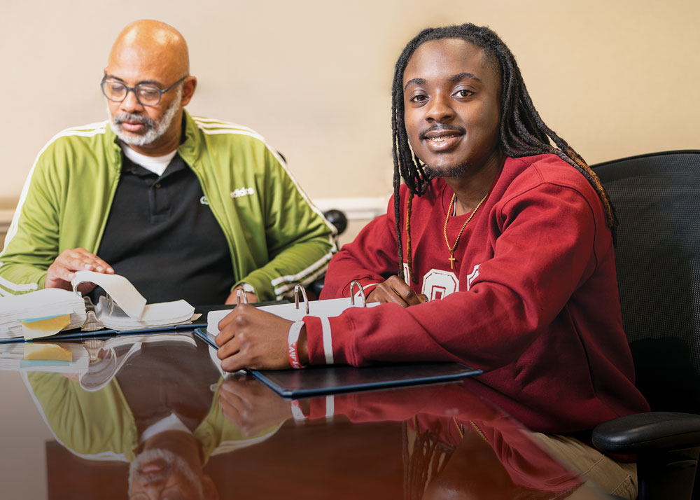 Kelvin Pearson sits with one of his mentors at Boykin & Davis, LLC.